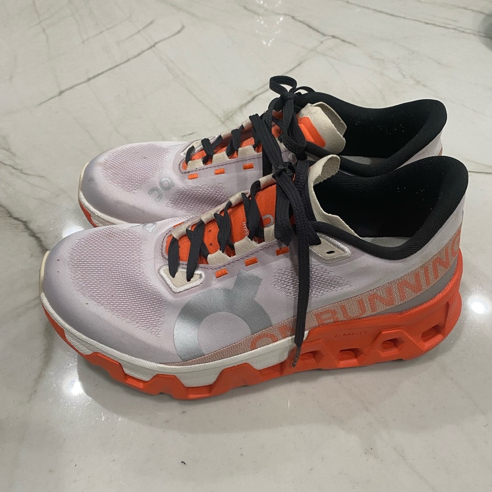 On Running Athletic Shoes in White and Orange